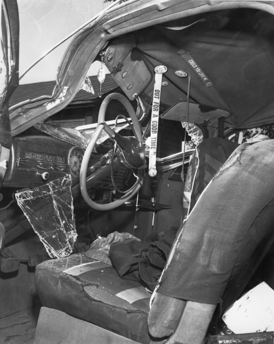 1954 black and white photograph of a car interior after an accident