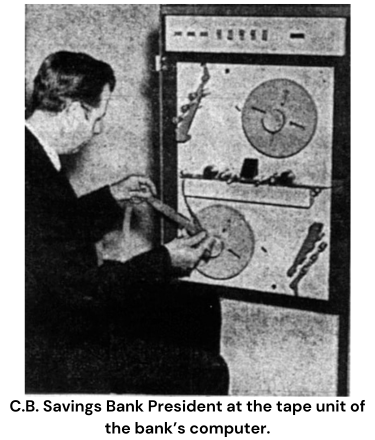 C.B. Savings Bank President at the tape unit of the bank’s computer.