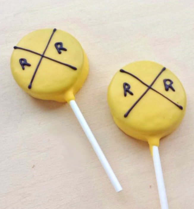 cookies on a stick that resemble railroad crossing signs