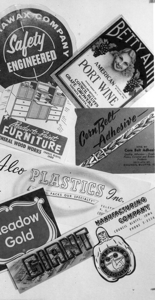 Photo of various company logos including Parawax Company, Betty Ann Port Wine label from the Council Bluffs Grape Growers Association, Ready-to-Paint Furniture by General Wood Works, Corn Belt Adhesive, Alco Plastics, Inc., Meadow Gold, and Giant Manufacturing Company