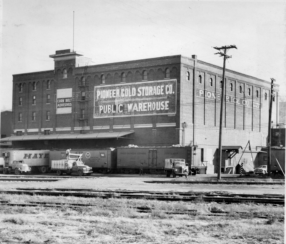 Photo of Pioneer Cold Storage building with Corn Belt Adhesives sign