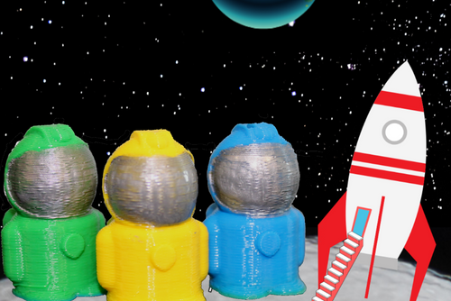 3-D printed astronauts on cartoon moon with cartoon spaceship