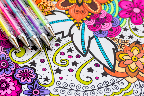 colored pens and a coloring sheet