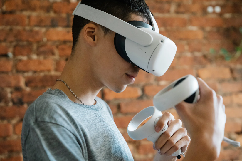 Teenage boy using a VR machine
