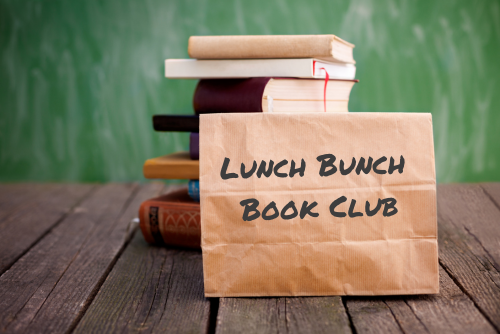 Brown paper lunch bag in front of a stack of books with Lunch Bunch Book Club on the bag.