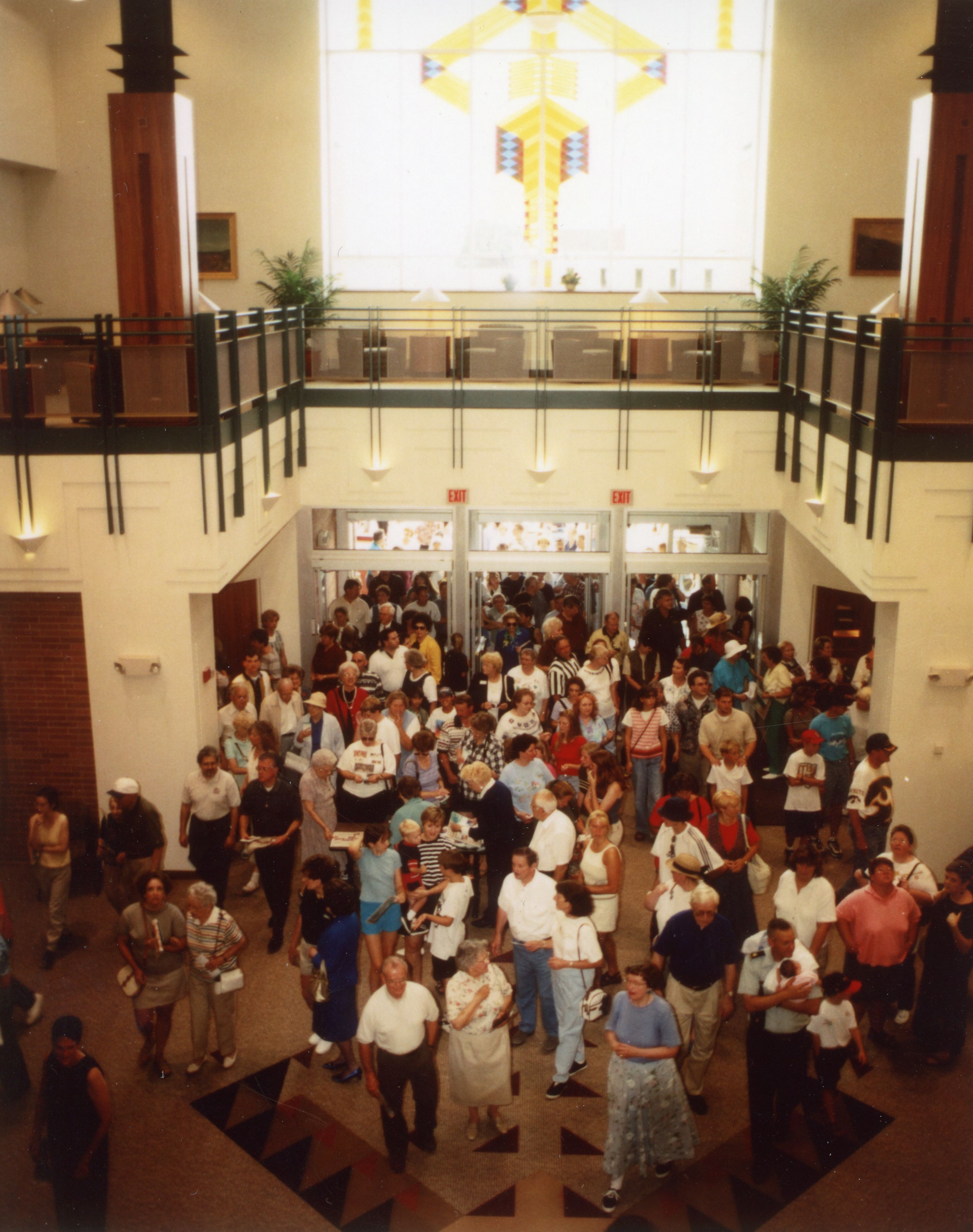 People entering doors of library