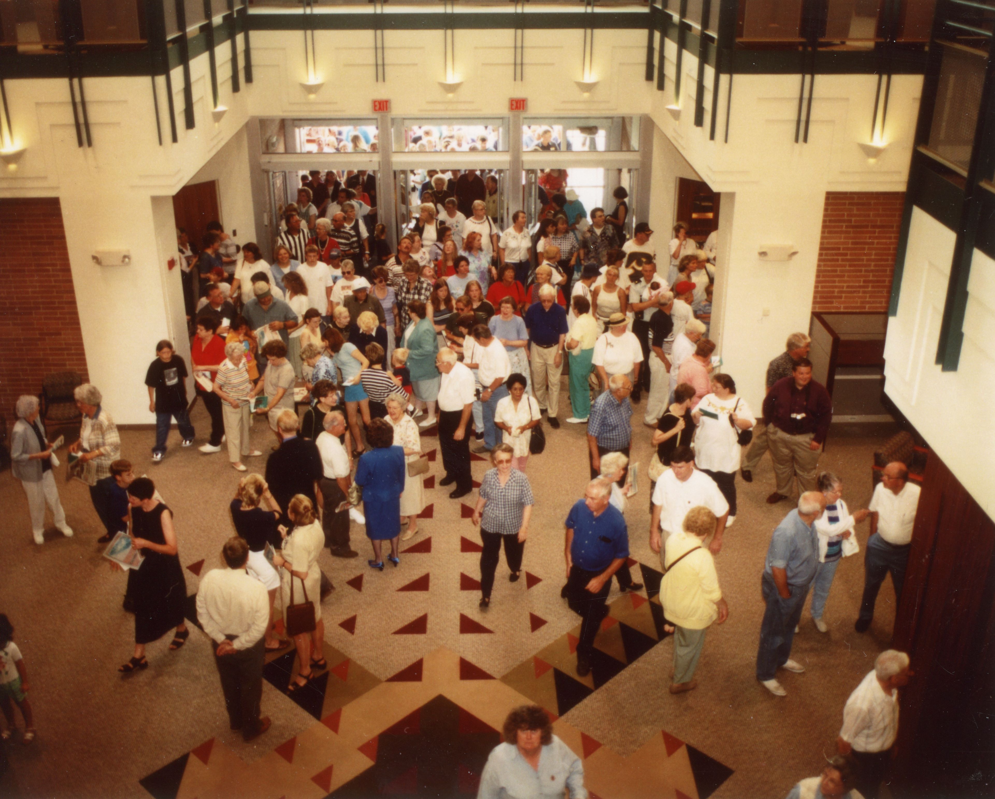 People entering doors of library