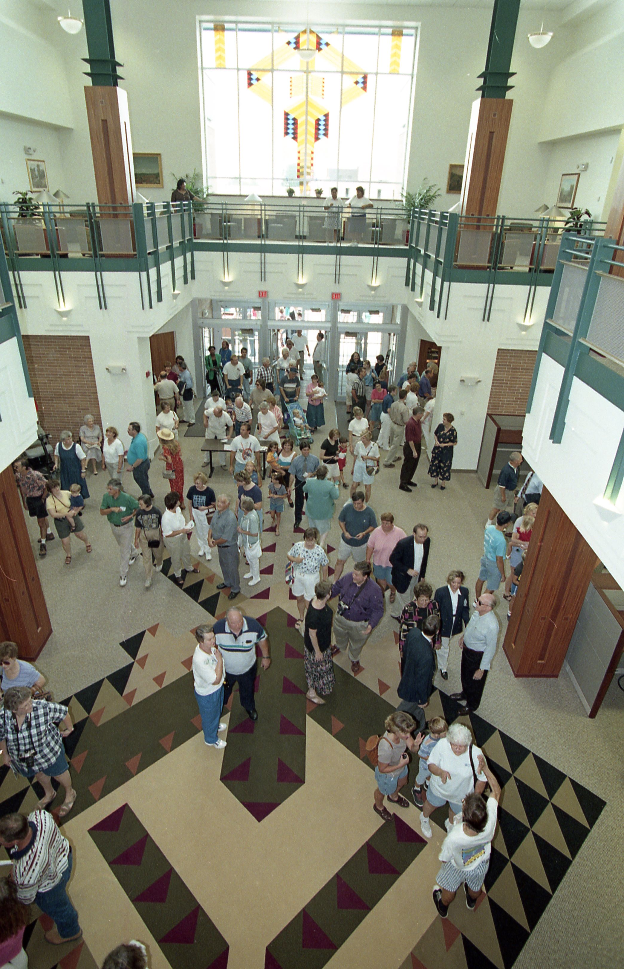 People entering doors of library