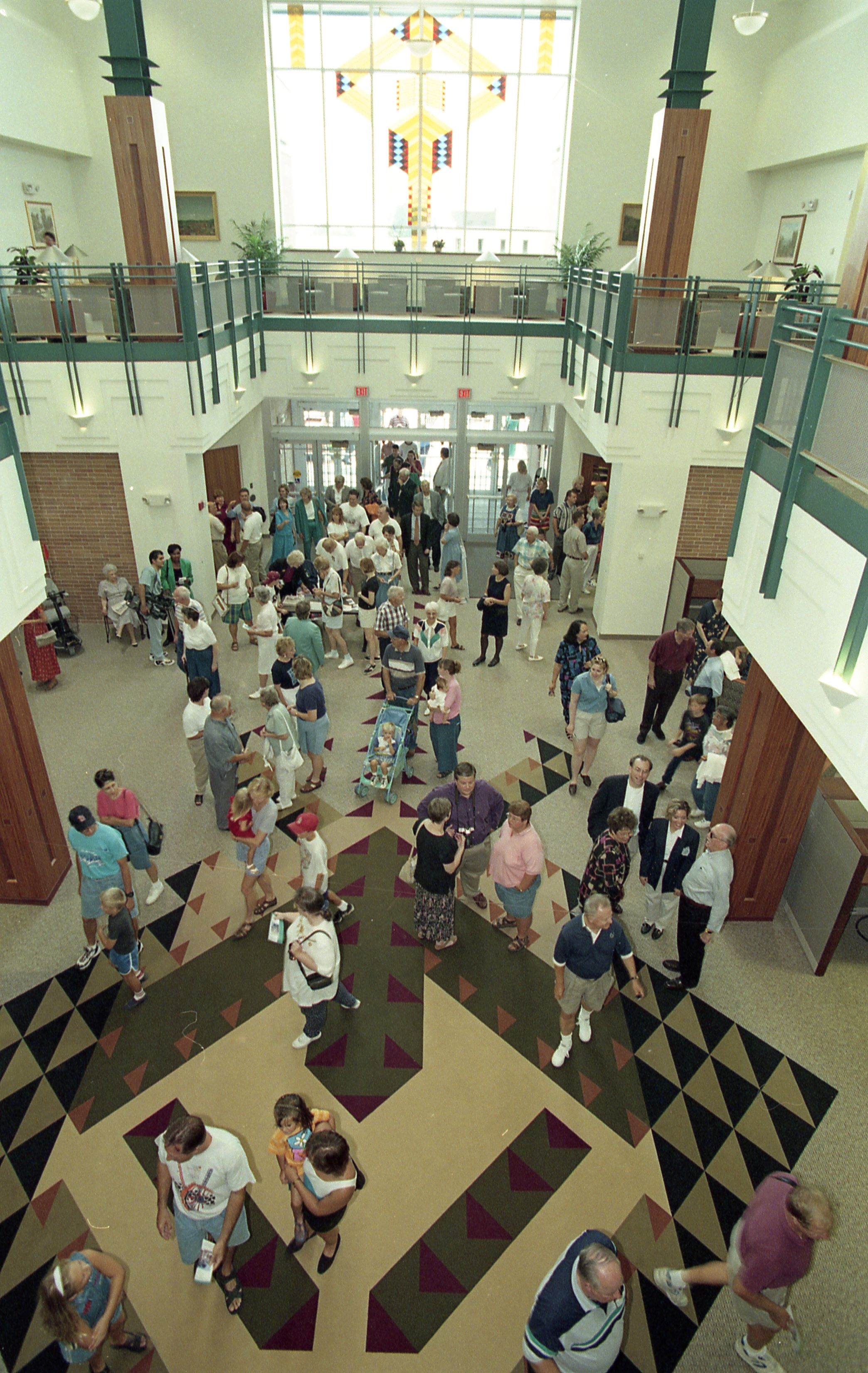 People entering doors of library