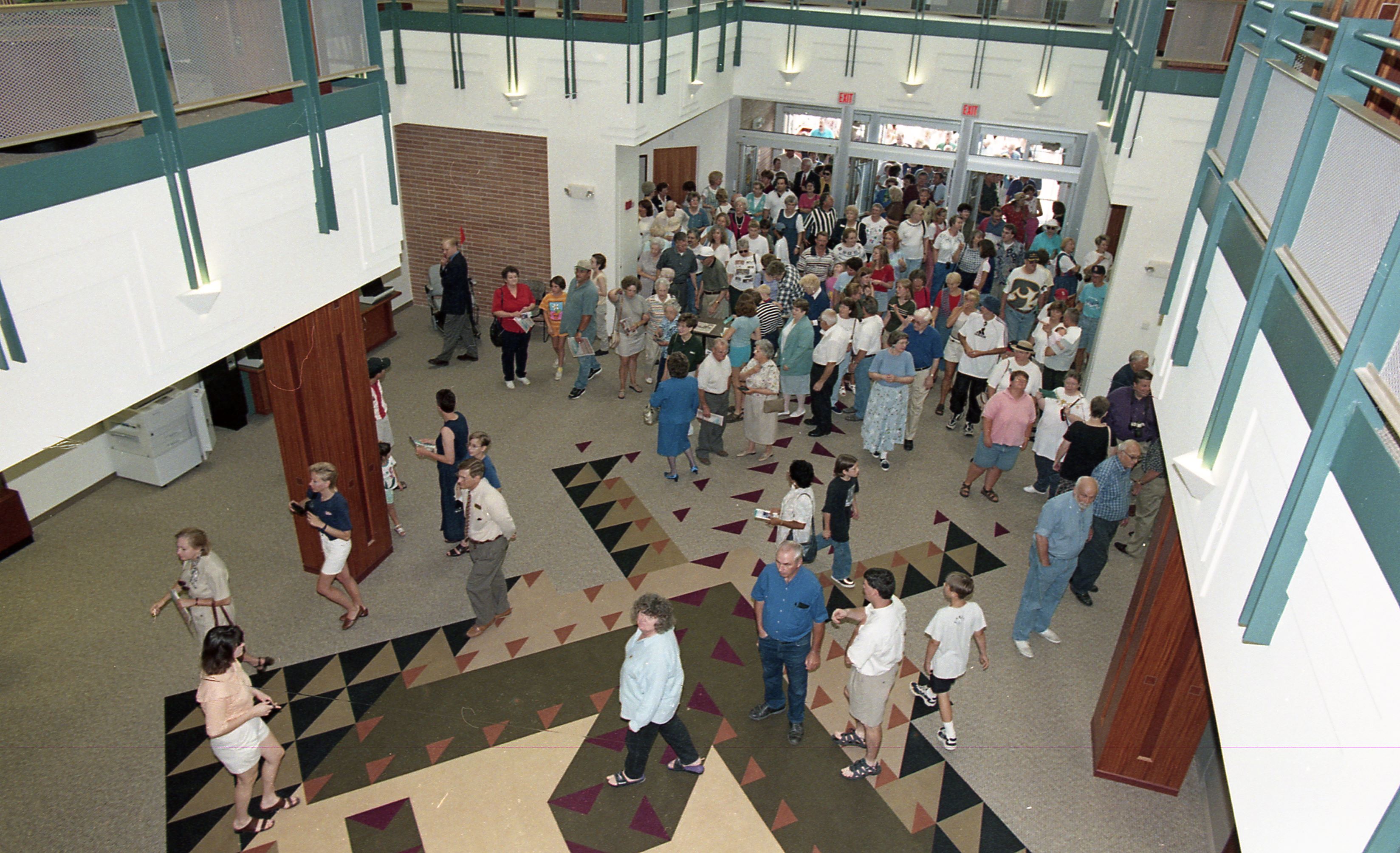 People entering doors of library