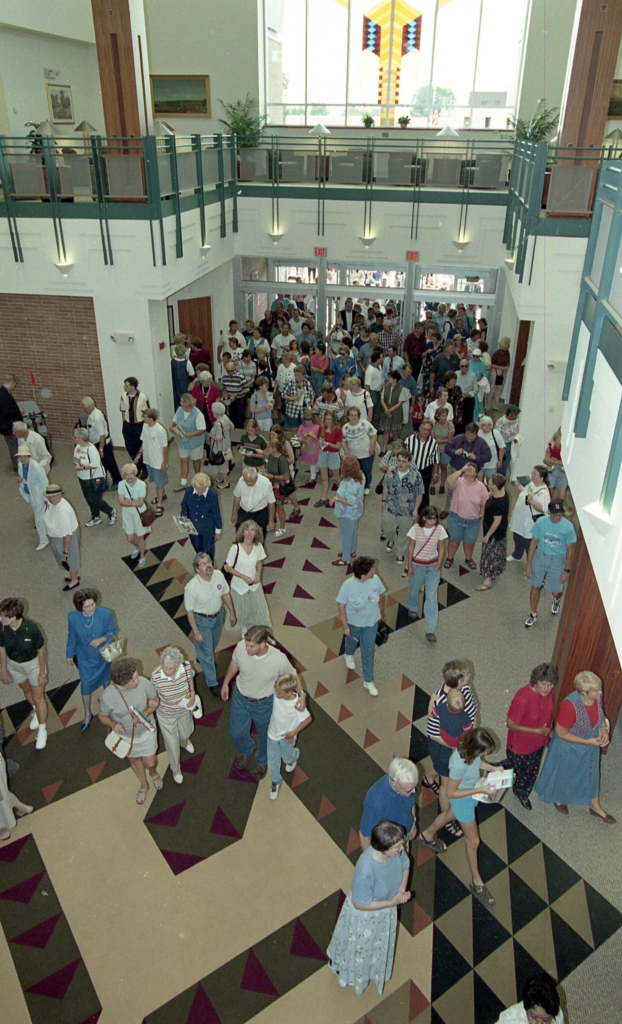 People entering doors of library
