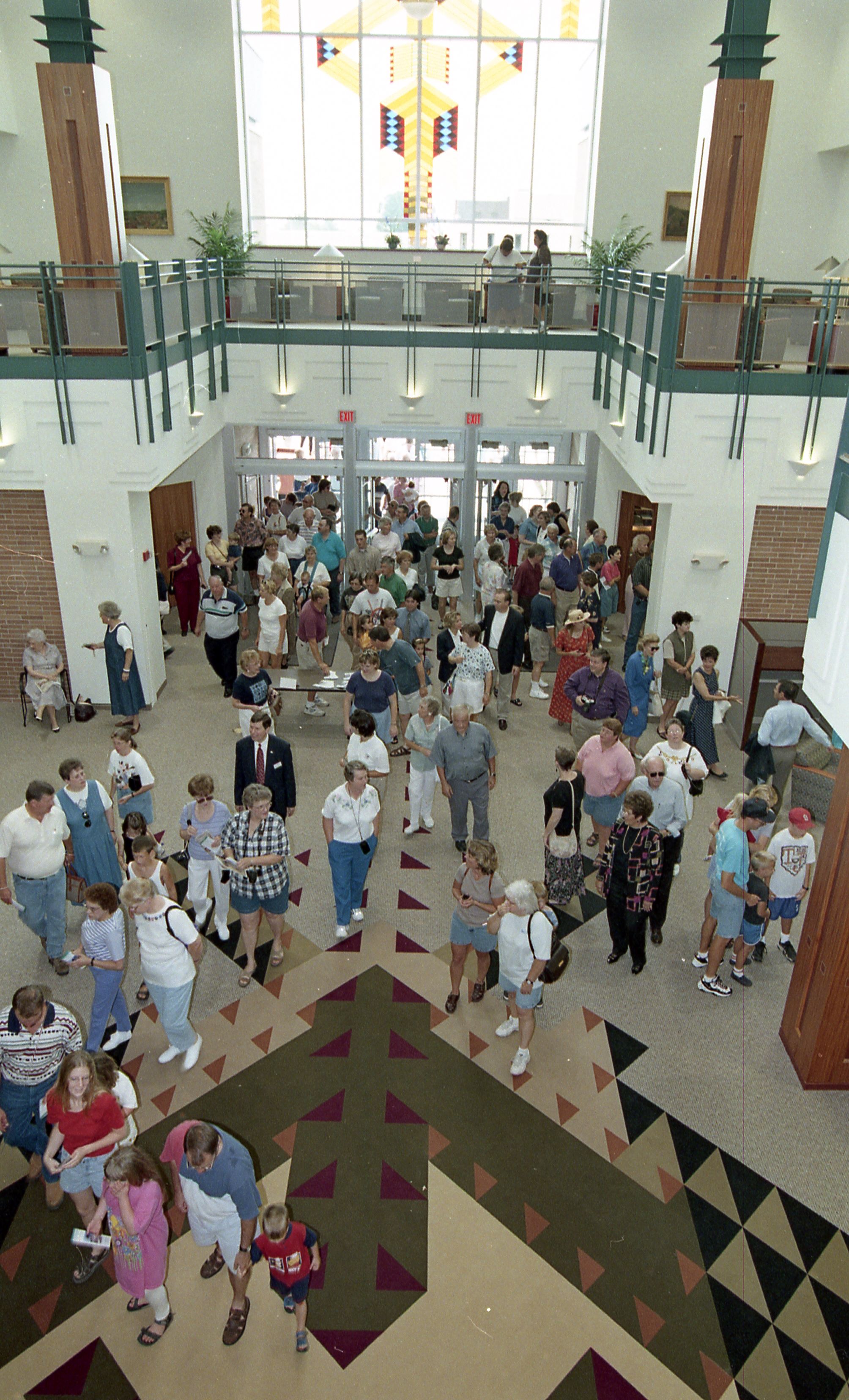People entering doors of library