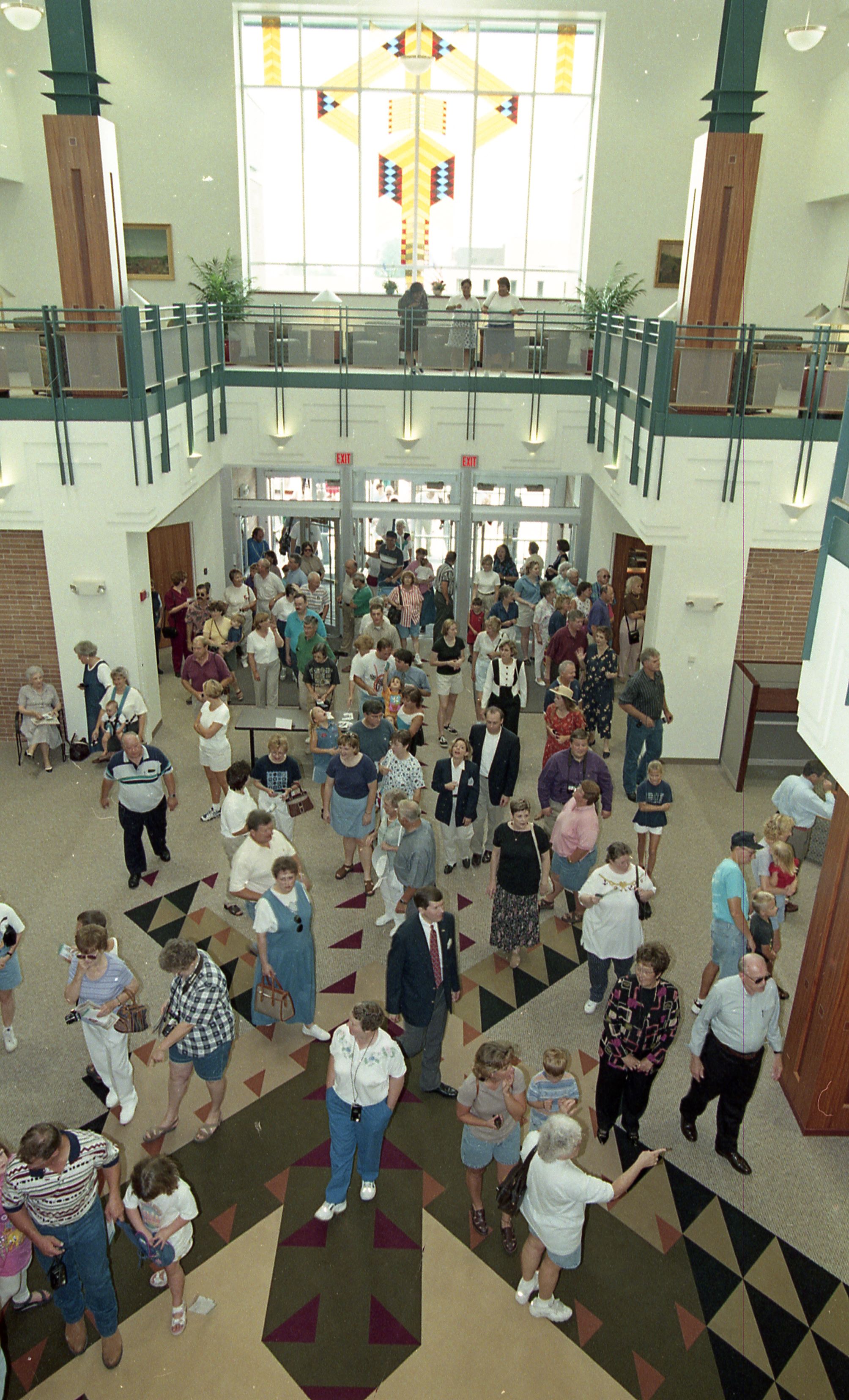 People entering doors of library