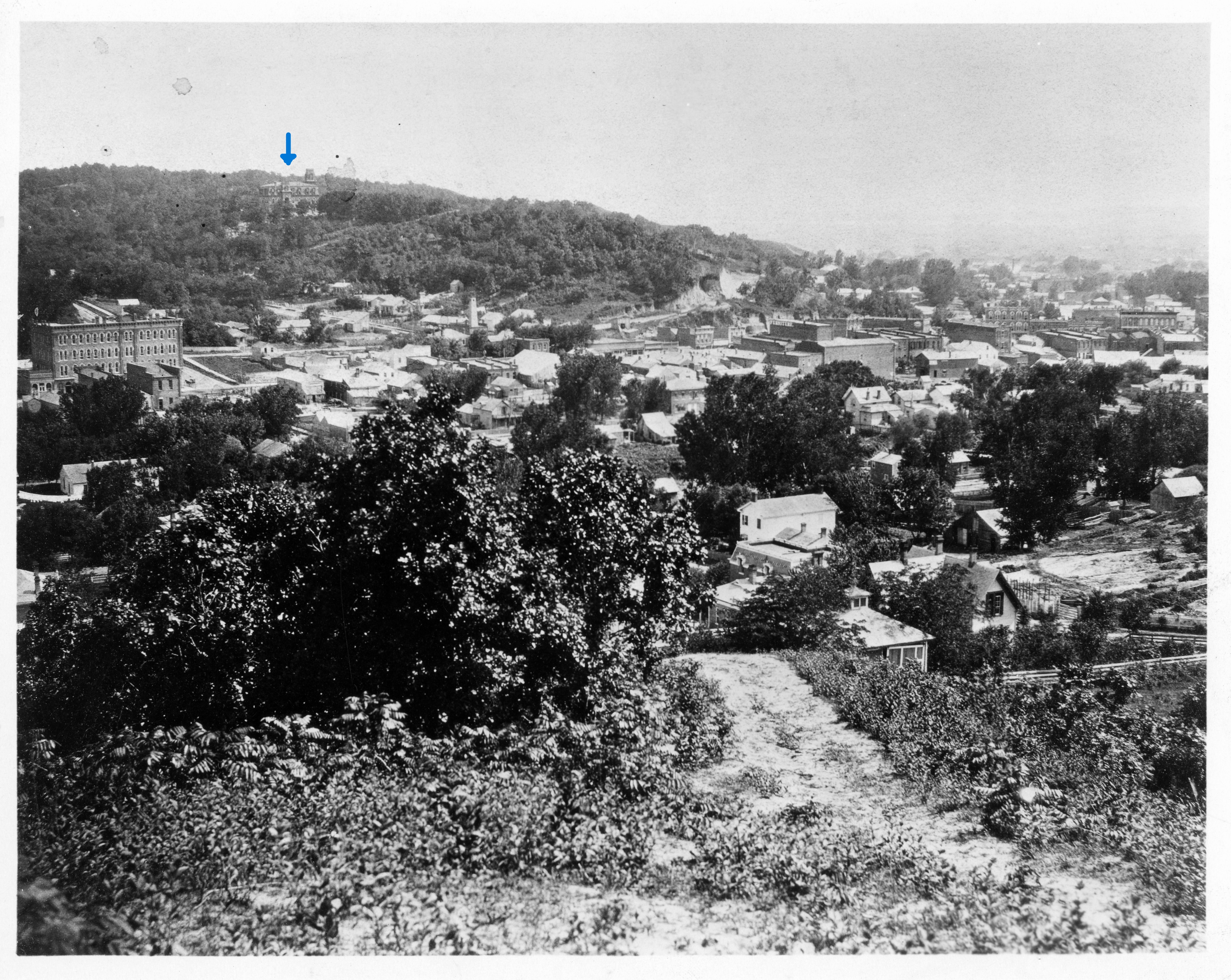 Bird's eye view of business section. Shows Old Ogden Hotel in left foreground and Old High School in background