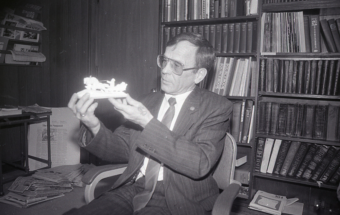 Master Ivory Carving Artist Gavriil Khazov holds a ivory sculpture carved in Tobolsk, the sculpture depicts a sleigh being pulled by deer or elk