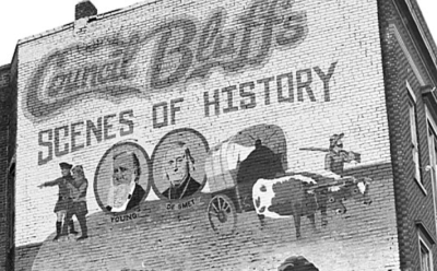 Photo of the upper third of the Council Bluffs Scenes of History mural at 542 W Broadway