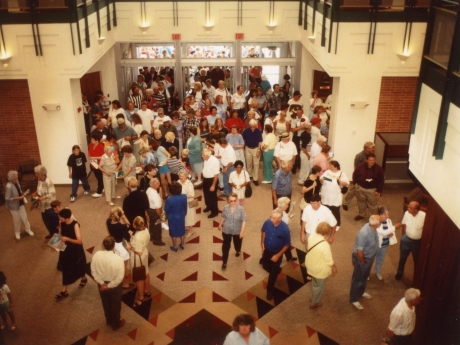 People entering doors of library