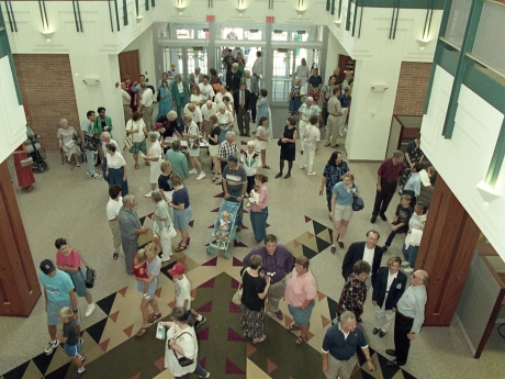 People entering doors of library