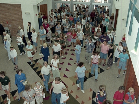 People entering doors of library