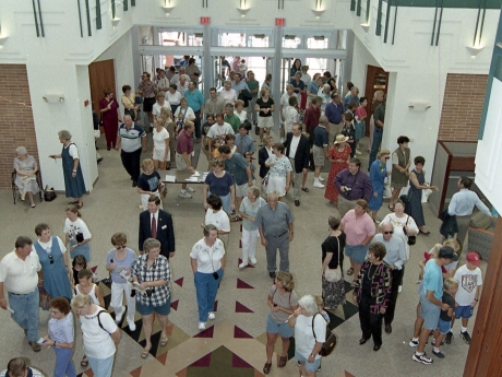 People entering doors of library