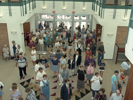 People entering doors of library