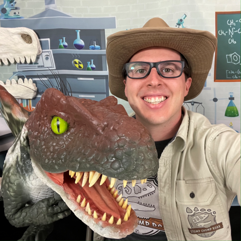 Ranger with a dinosaur puppet.