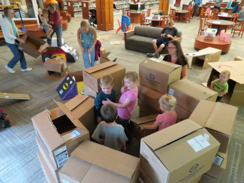 Children playing with boxes