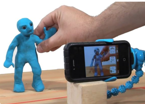 perosn with clay man making film