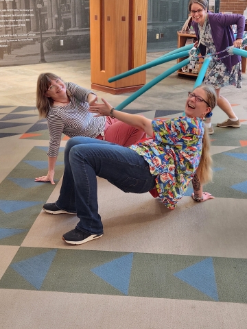 People crab walking on the floor and someone with an "octopus"