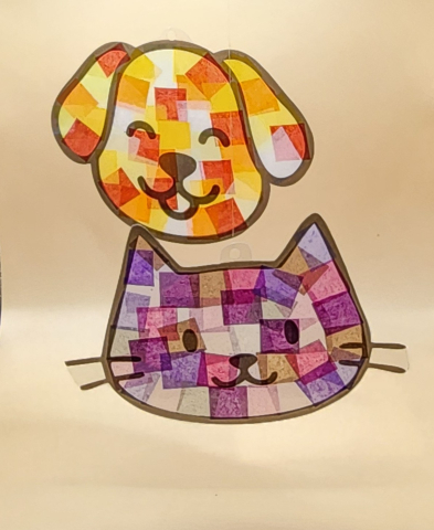 Cat and dog suncatchers made with tissue paper.