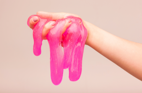 pink slime dripping from a hand