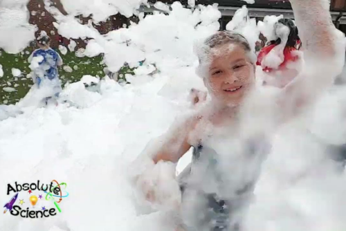 Children playing in bubbles.