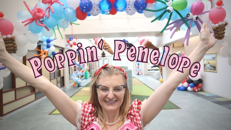 Penelope with her hands raised.