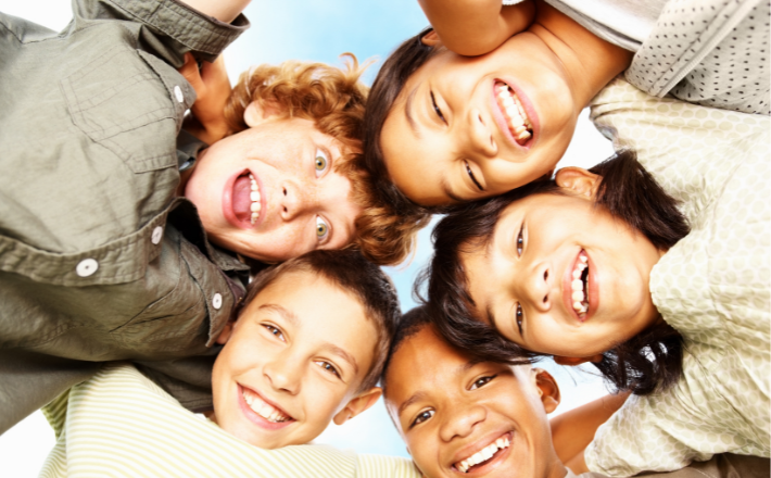 Children in a huddle.