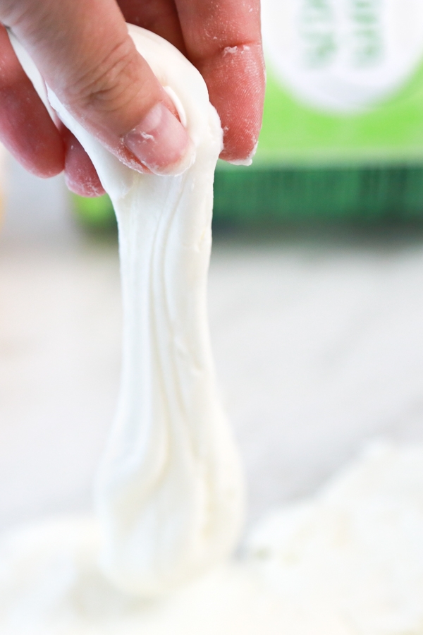 hand making cloud dough