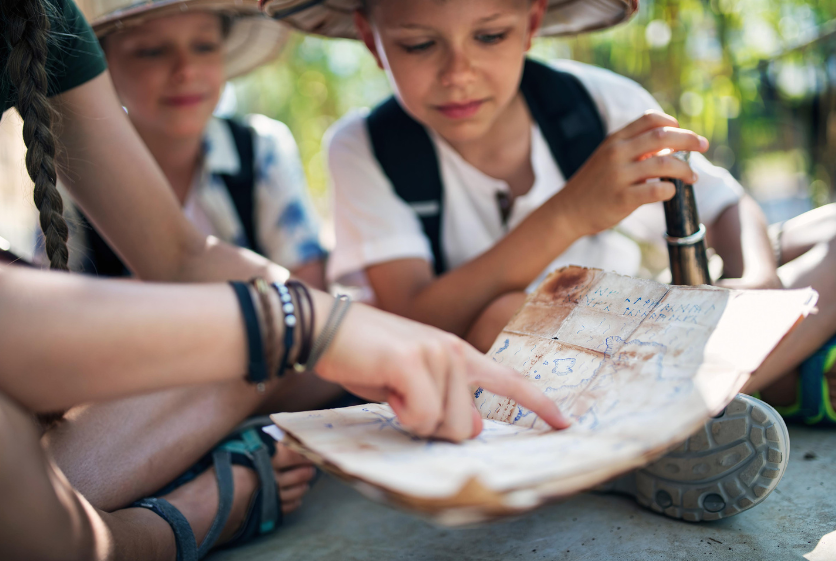 Kids looking at a map.