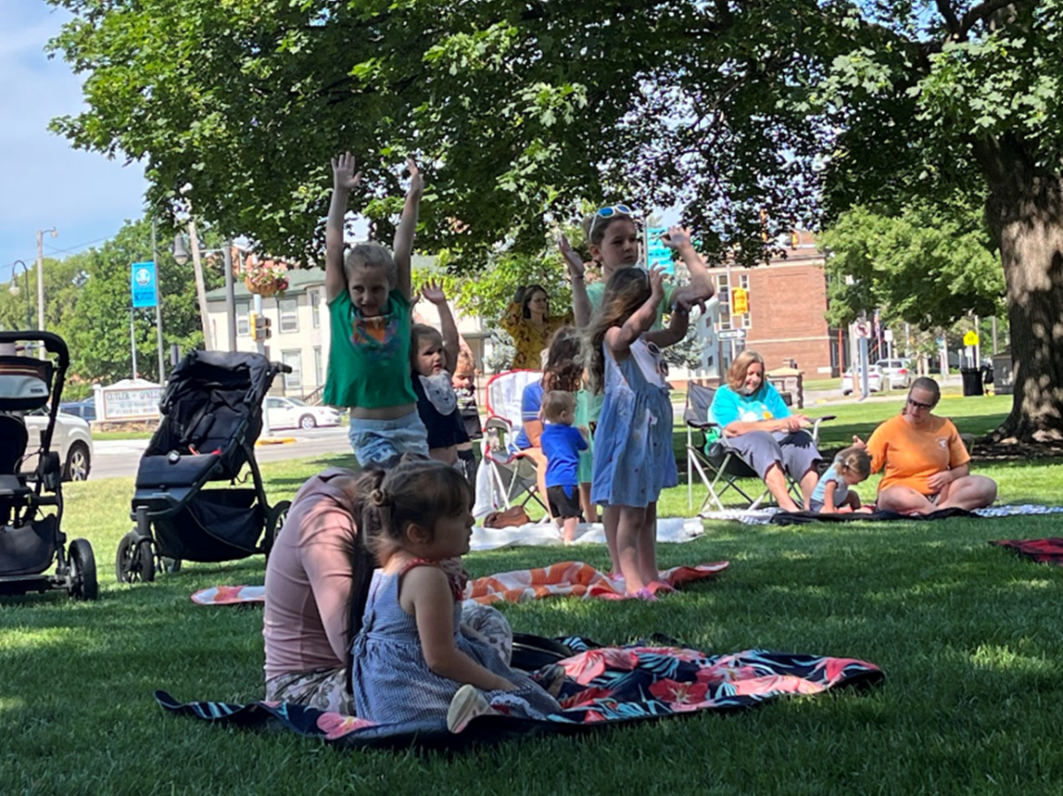 Kids dancing in the park.