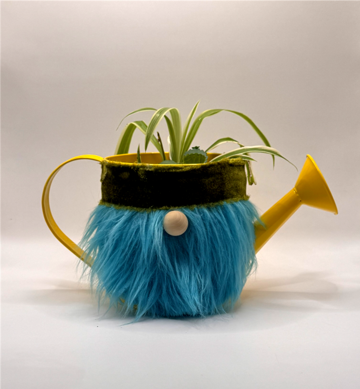 watering can gnome with a plant inside