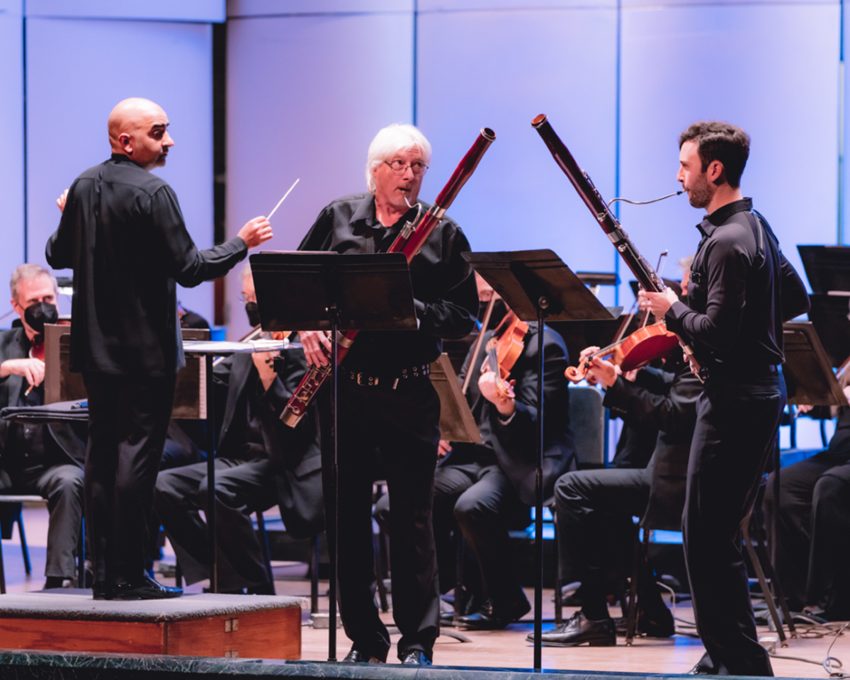 People playing the bassoon.