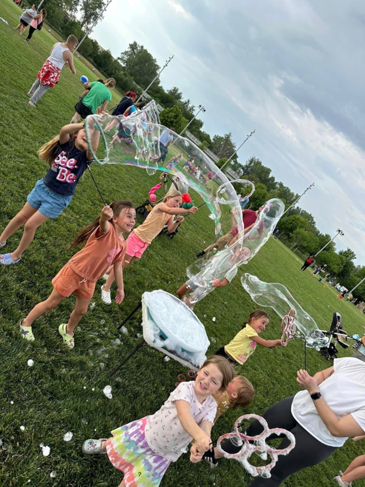 Children blowing bubbles.