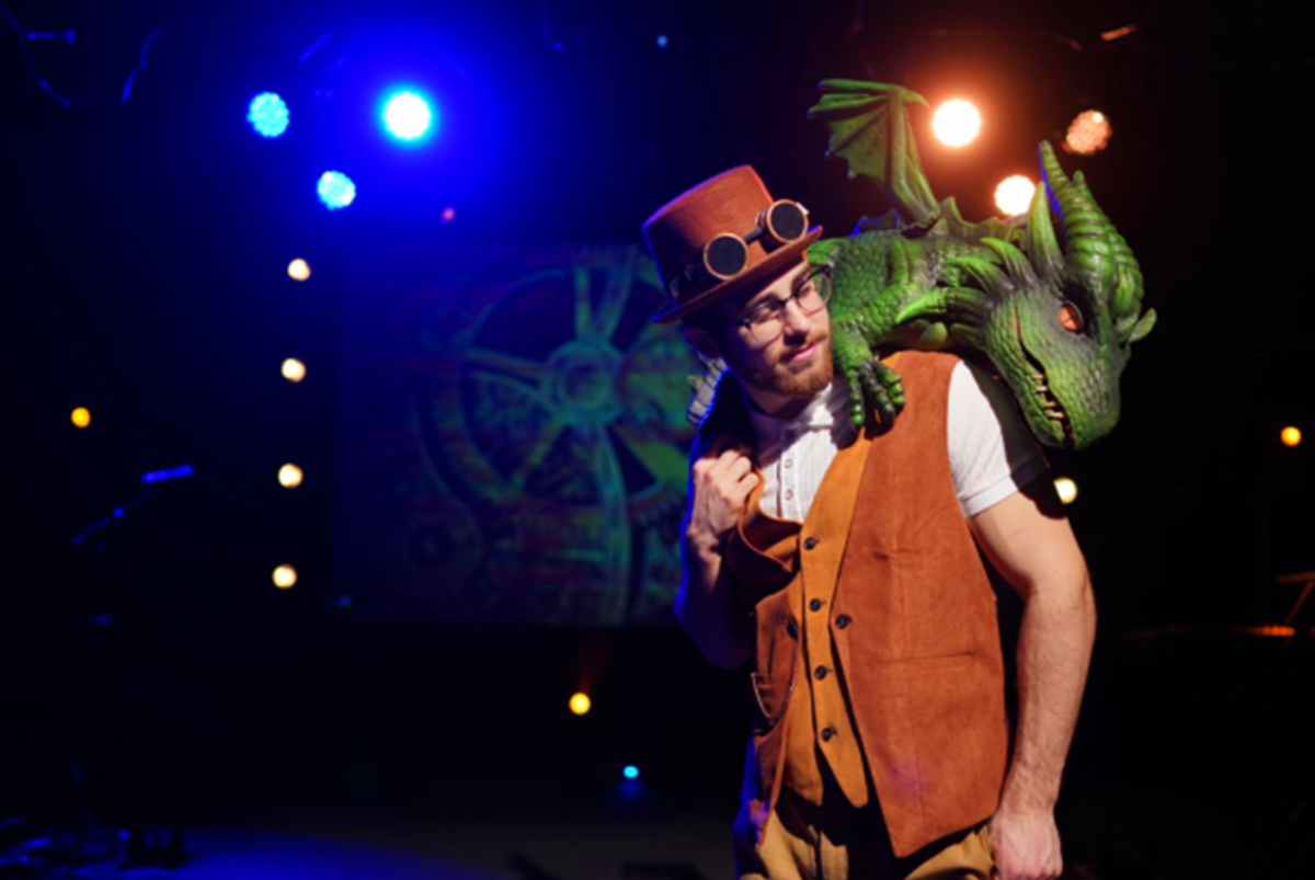 Man with a dragon puppet.