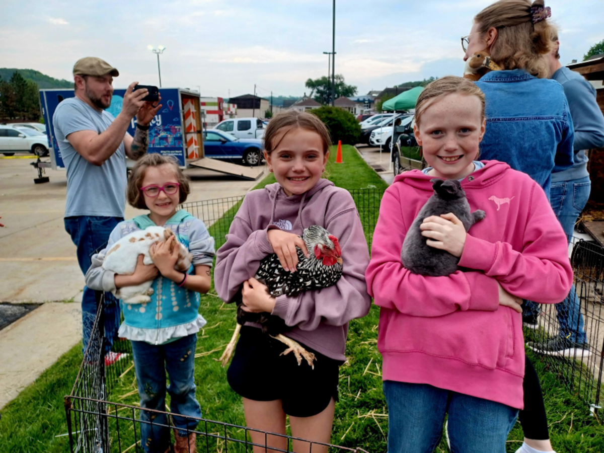 Children holding animals.