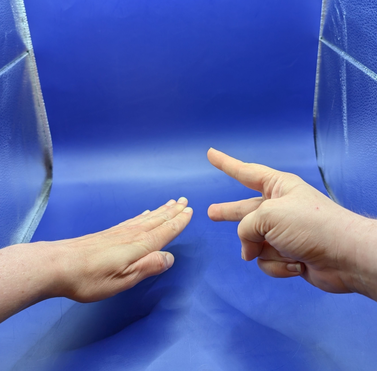 Hands playing rock, paper, scissors.