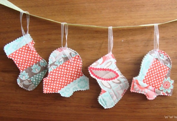 Sample quilt-as-you-go ornaments - two stockings and two bells.