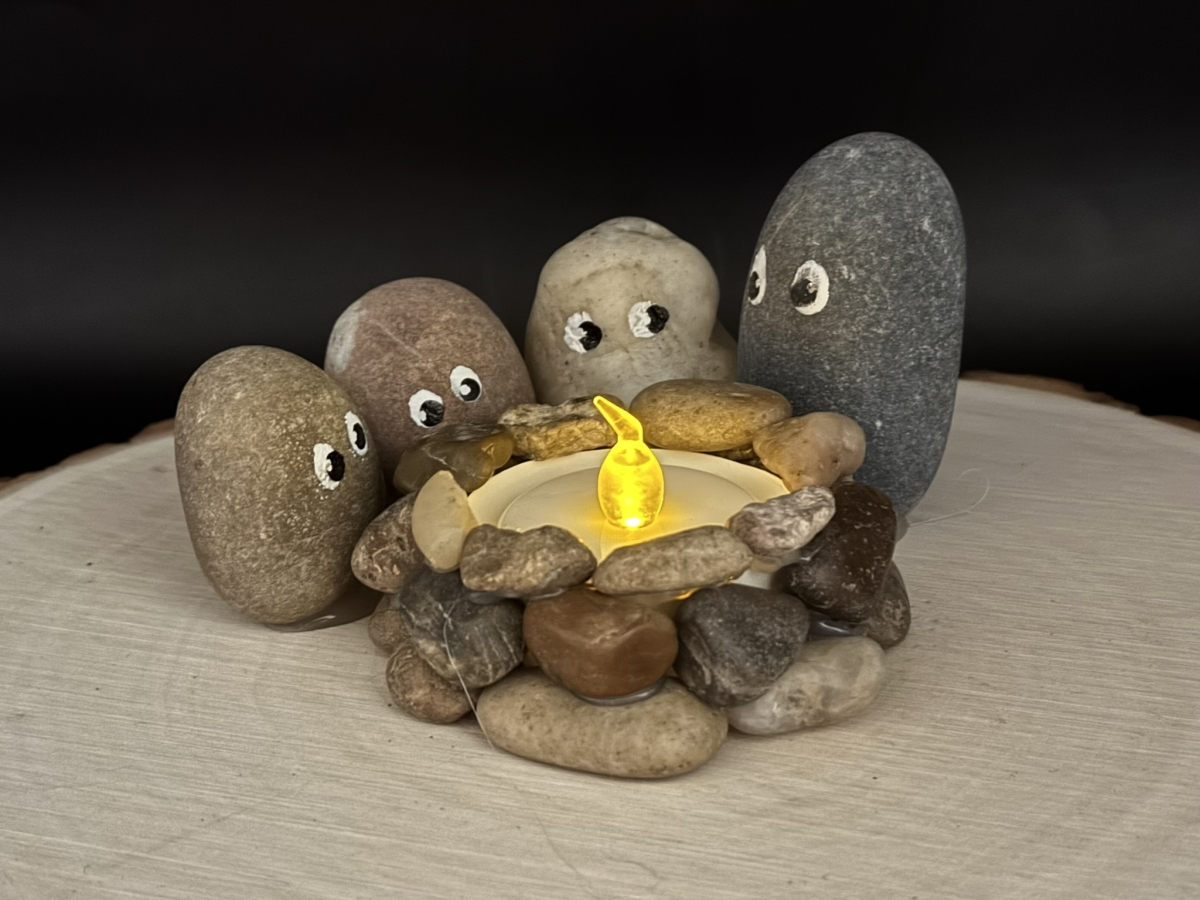 Rock people around a campfire