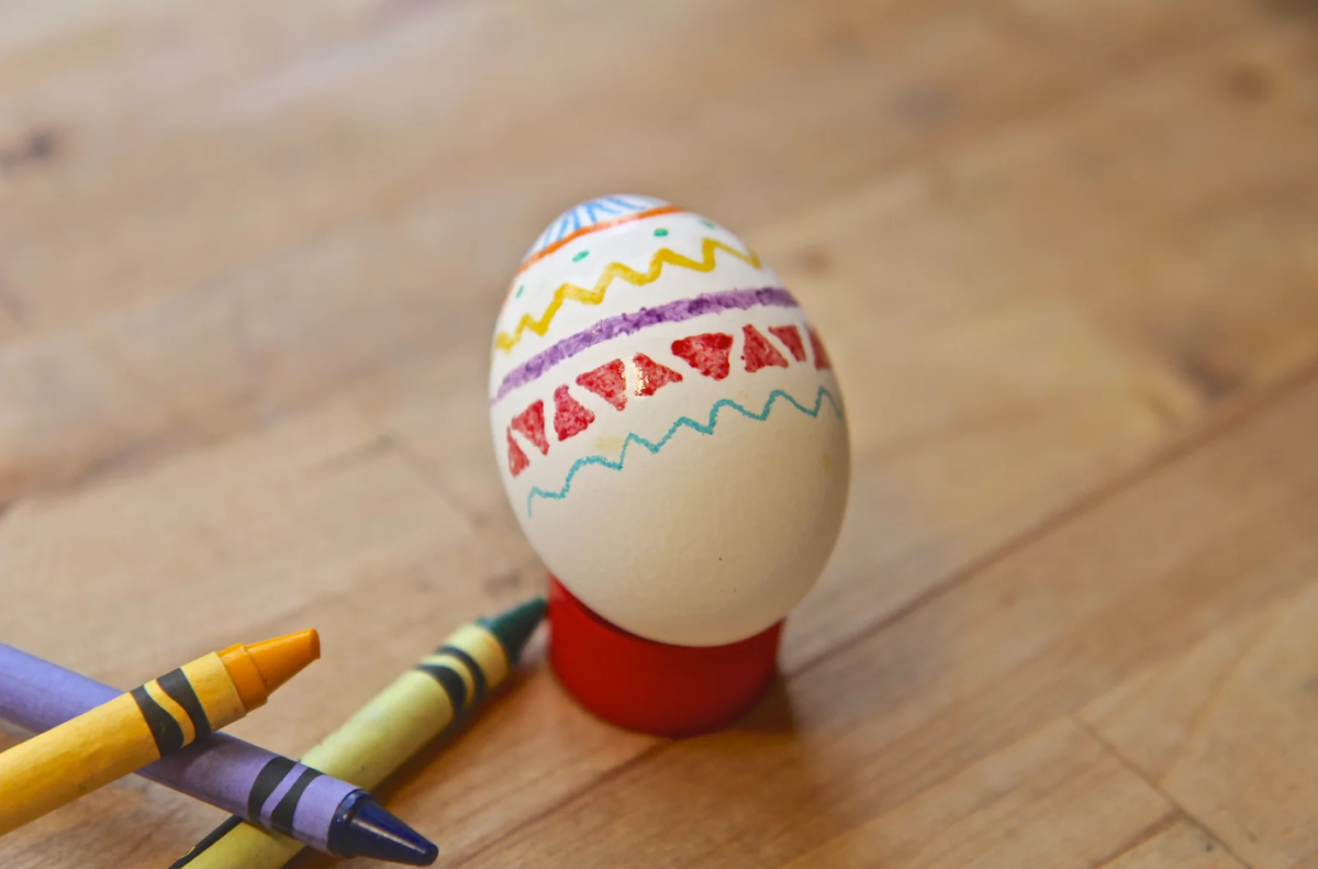 Egg in the process of wax decorating