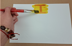 Person using invisible ink to decode a message.