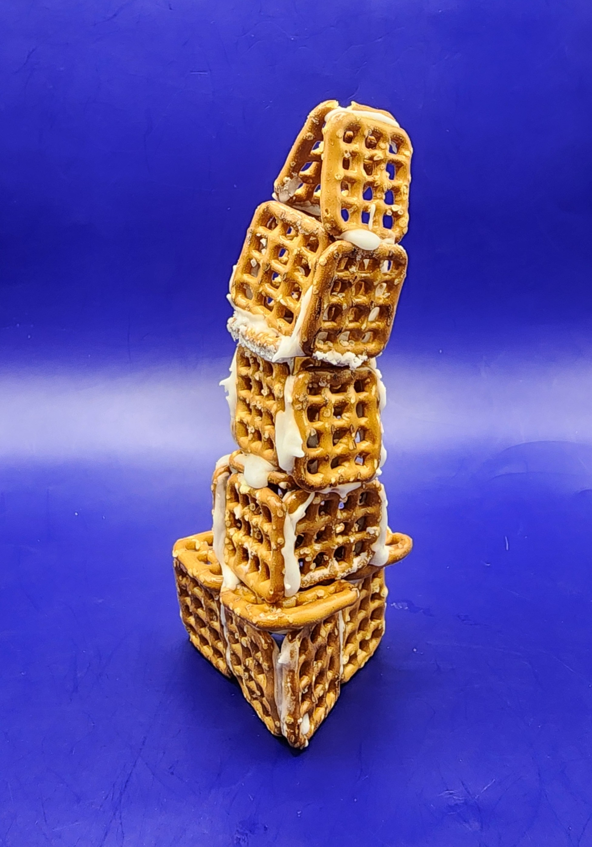 Tower made out of pretzels and frosting.