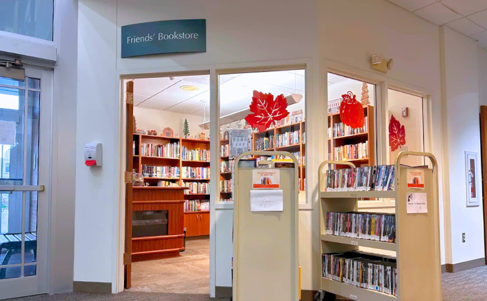 Friends of the Library bookstore with an open door and book carts placed outside