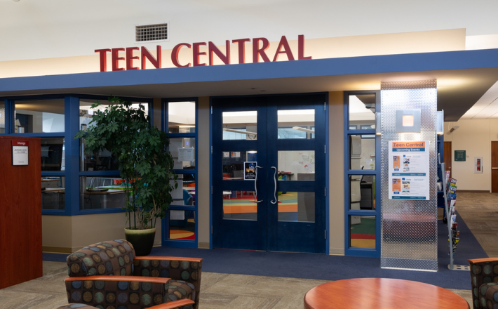 Teen Central entrance with closed doors and soft cushion chairs in front 